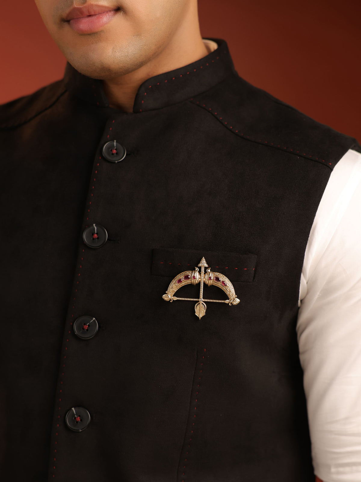 The Ruby Royal Dhanush brooch - antique gold brooch for men with ruby royal dhanush motif, angled view