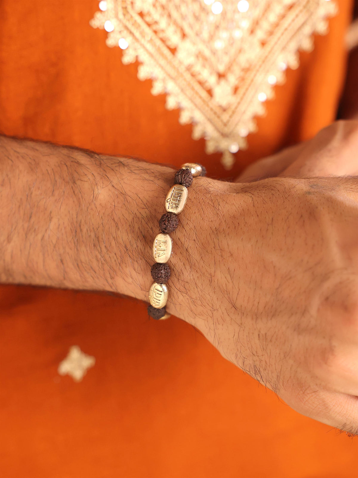 Ram Viraasat bracelet - antique gold bracelet for men with ram viraasat motif, close-up view