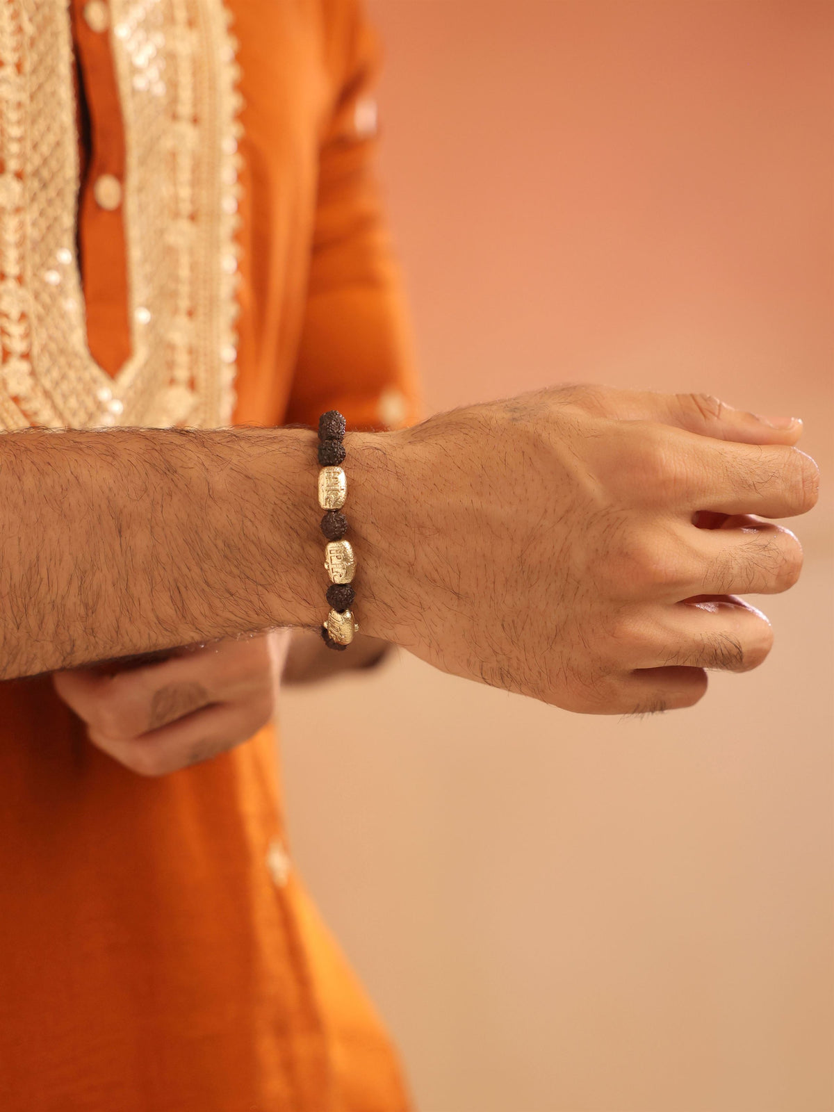 Surya Viraasat bracelet - antique gold bracelet for men with surya viraasat motif, worn on outfit
