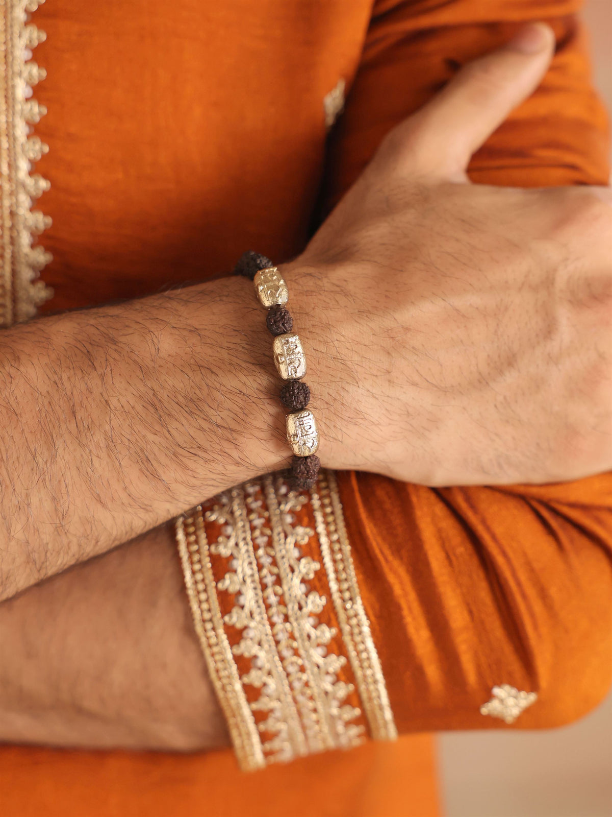 Surya Viraasat bracelet - antique gold bracelet for men with surya viraasat motif, on model